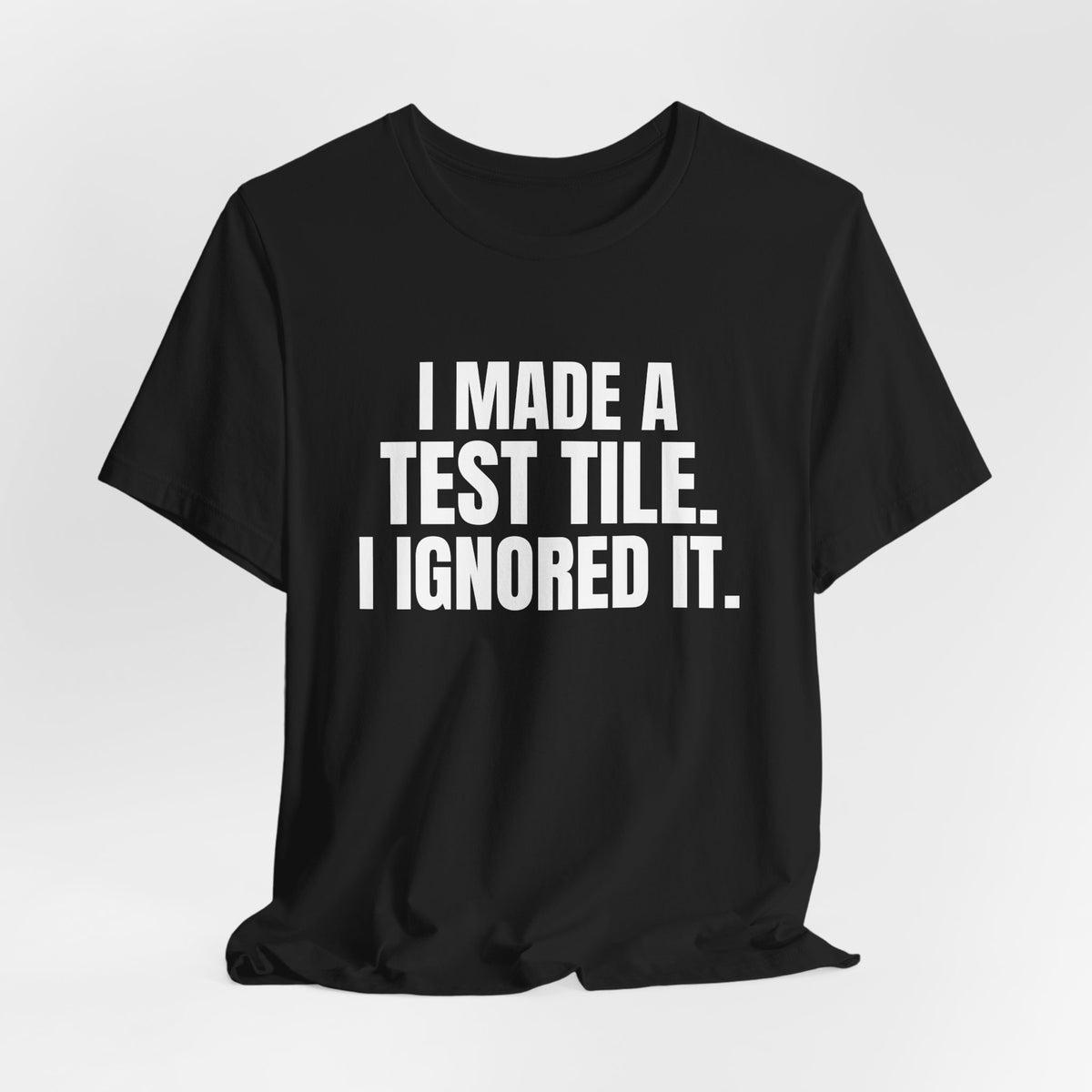I Made a Test Tile I Ignored It Pottery Shirt, Black hanging view, digital mockup