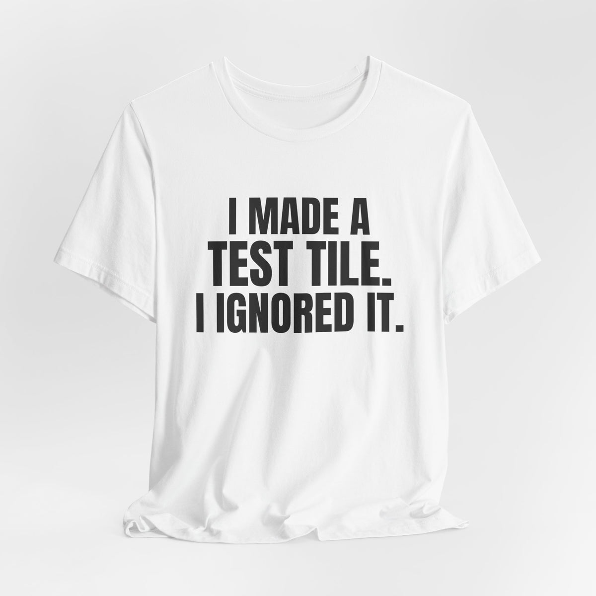 I Made a Test Tile I Ignored It Pottery Shirt, White hanging view, digital mockup
